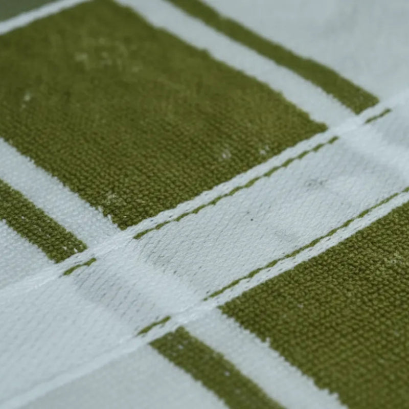 Close-up of a green and white checkered fabric pattern
