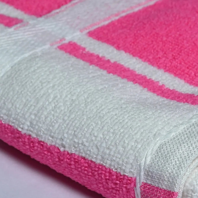 Fabric closeup of pink and white checkered towel