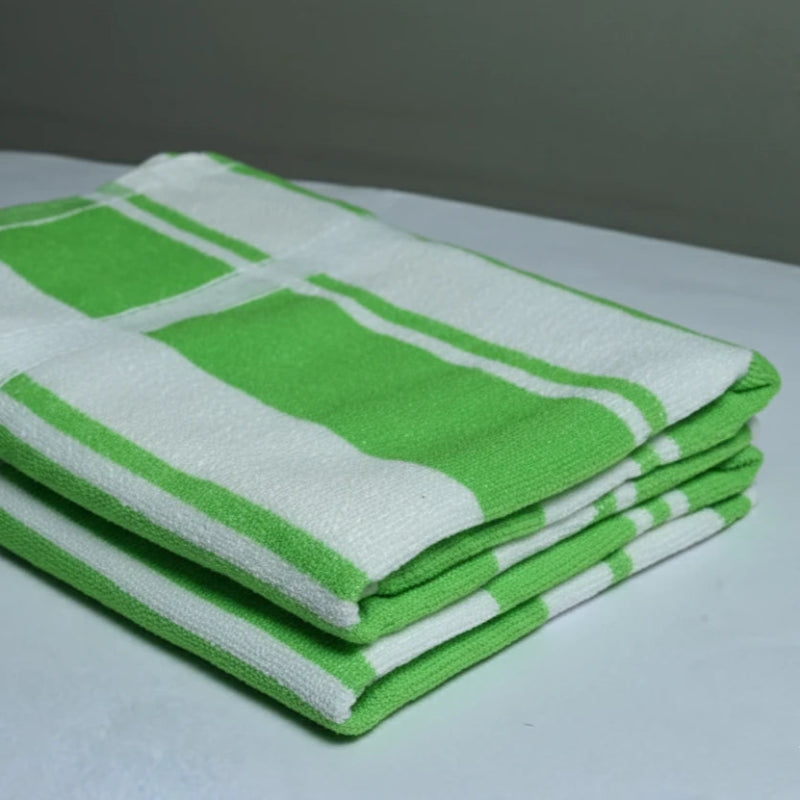 Stack of 2 green and white checkered towels on a gray surface
