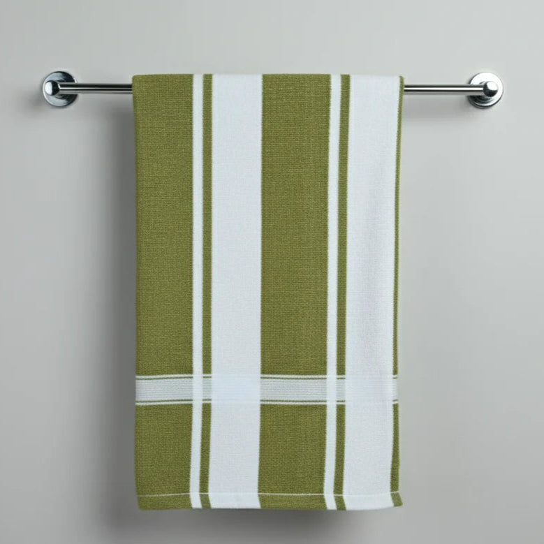 Green and white striped towel hanging on a silver towel rack against a gray background