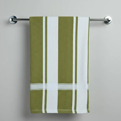 Green and white striped towel hanging on a silver towel rack against a gray background