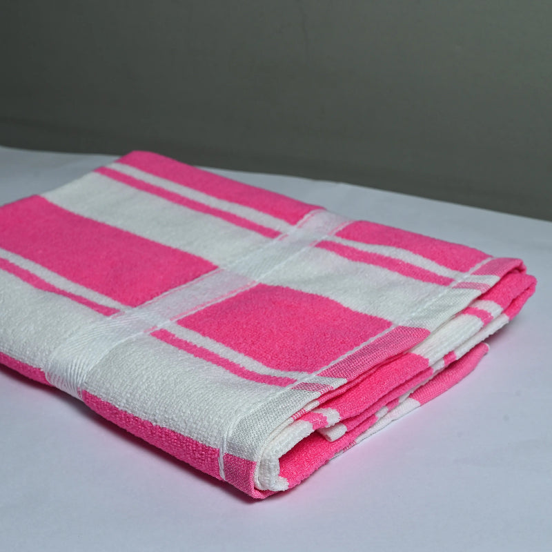 Folded pink and white checkered towel on a light gray surface
