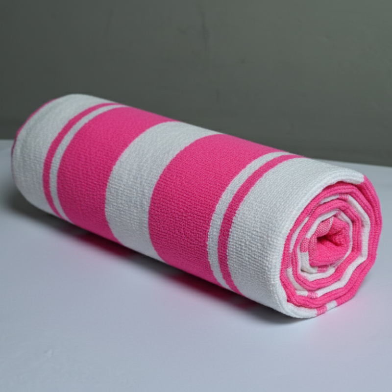 Rolled-up towel with pink and white stripes on a gray background