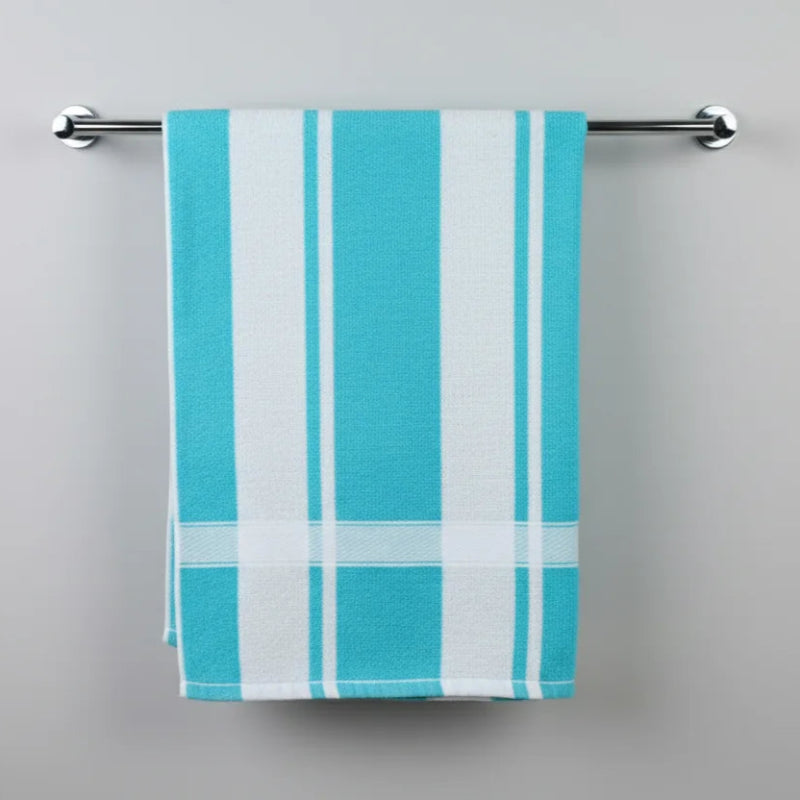 Turquoise and white striped towel hanging on a silver rack against a gray background