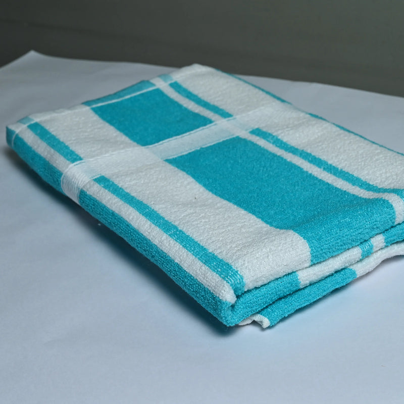 Folded turquoise and white checkered towel on a light gray surface