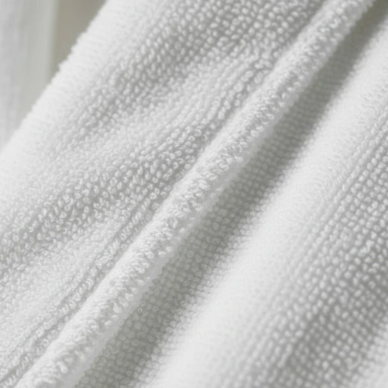 Close-up of textured white bath robe