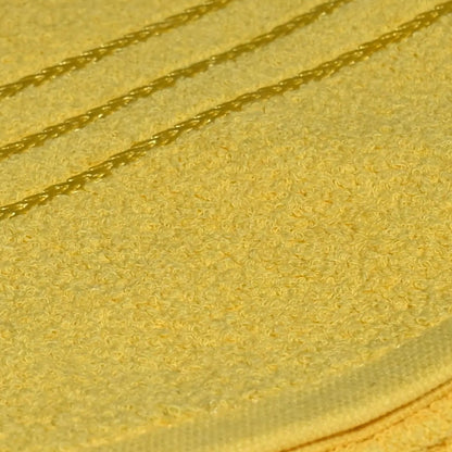 Yellow towel fabric closeup on a white surface with a blurred background
